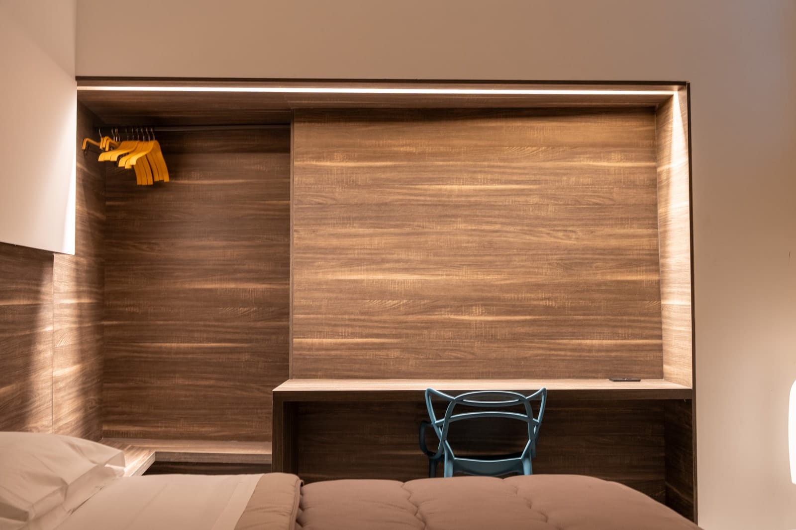 The desk and the wardrobe in Hestia, built into the same wooden wall